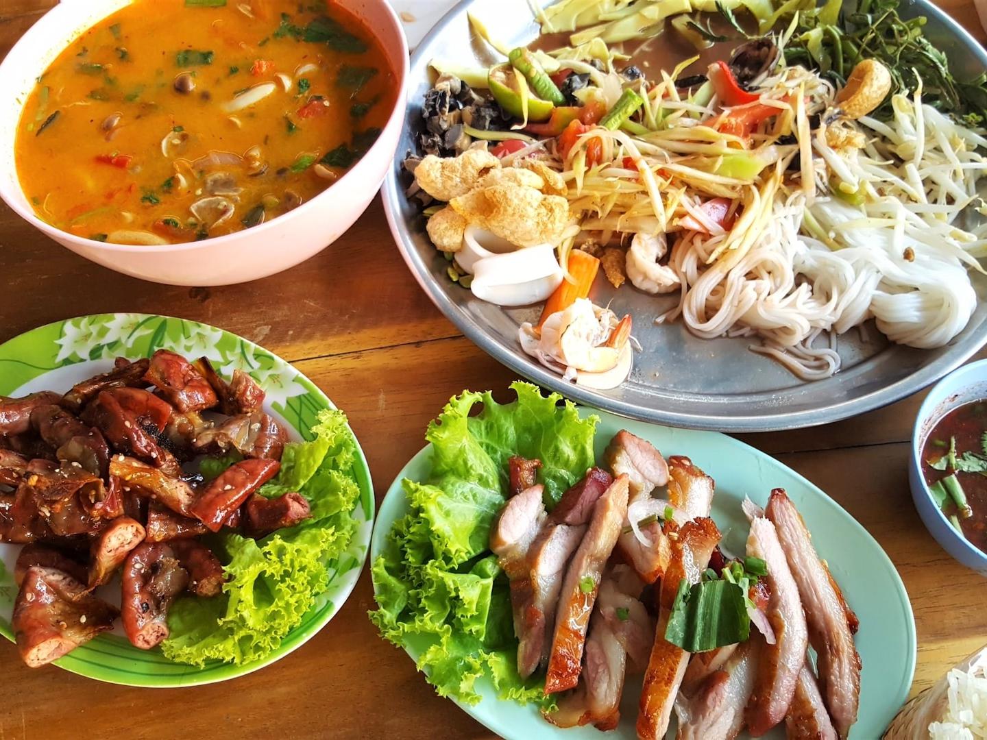 pasta with vegetables near meat with cabbage and stewed food in bowl